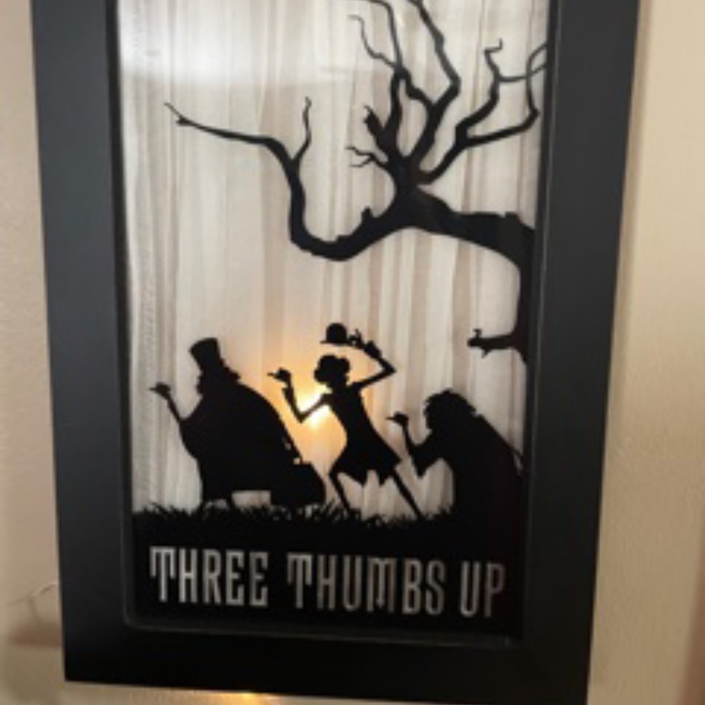 The Haunted Mandion Hitch Hiking Ghosts Three Thumbs Up Light Up Hanging Picture